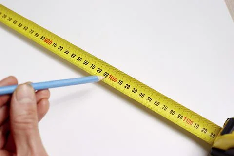Construction tape, a tool for measuring the length of a close-up. Constructio Stock Photos