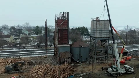 A construction team is active at a building site in a cold winter setting Stock Footage 345686412