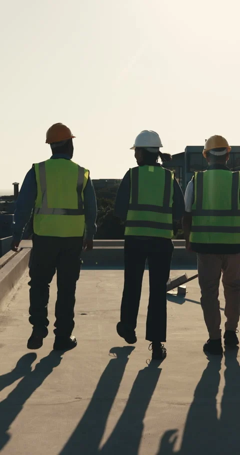 Construction, team and back of people on rooftop for meeting, planning and Stock Footage 345653348