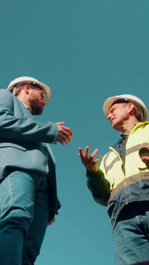 Construction, team and men planning with low angle, building development or Stock Footage 336215022