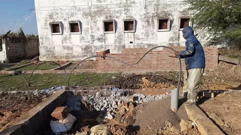 Construction Team cleaning the borewell in the rural village Stock Footage 199676646