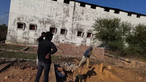 Construction Team cleaning the borewell in the rural village Stock Footage 199676784