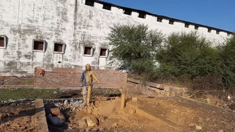 Construction Team cleaning the borewell in the rural village Stock Footage 199676978