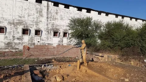 Construction Team cleaning the borewell in the rural village Stock Footage 199677209