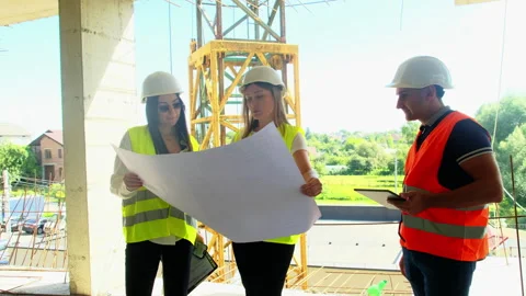 Construction team with helmets review architectural plans 스톡 동영상 317613949
