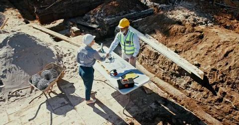 Construction team, outdoor and engineer people shaking hands for partnership Fotos Stock