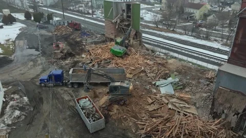 Construction Team Removes Debris From Old Building in Local Area Near Train.. Stock Footage 331955823