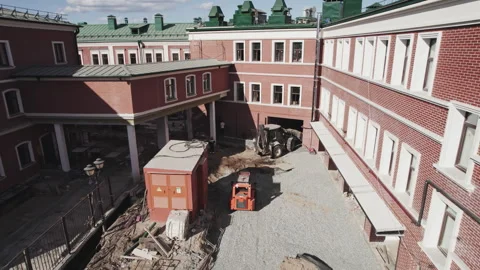 Construction team renovating public building with machinery Stock Footage 248278050