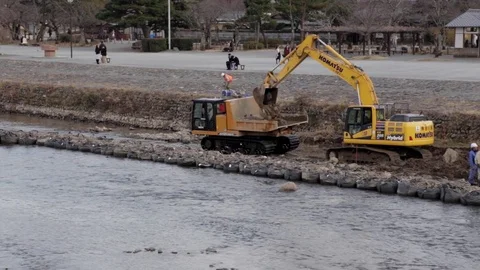 Construction Teams Move Rocks on River Stock Footage 73164158