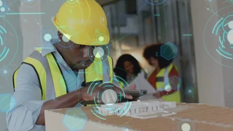 Construction tech studying tablet, aligning scanner over model, capturing data Stock Footage 333838163