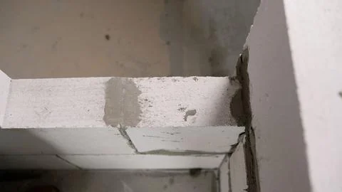 Construction technologies. The construction of a wall of blocks inside the Stock Photos