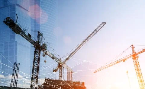 Construction technology banner background. Construction site with cranes Stock Photos