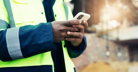 Construction, text or hands in site with phone, task instruction or inspect.. Stock Photos