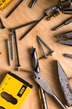 Construction theme. Working Tool on a Wooden Background Stock Photos