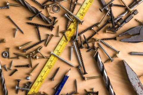 Construction theme. Working Tool on a Wooden Background Stock Photos