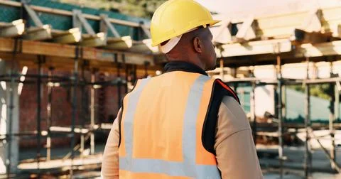 Construction, thinking and back of black man for inspection, planning and Stock Photos