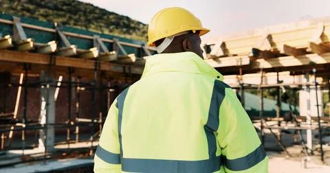 Construction, thinking and back of man outdoor for inspection, planning or Stock Photos
