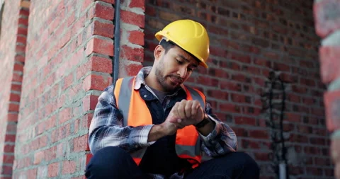 Construction, thinking and watch with man on building site for delay or project Stock Footage 336226862