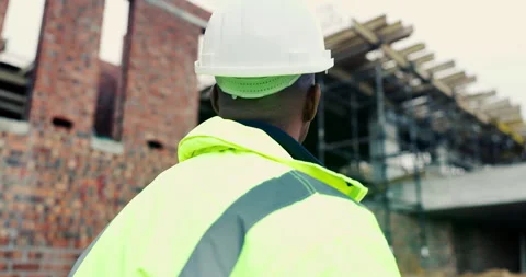 Construction, thinking or man on site with helmet, progress reflection or Stock Footage 336791978