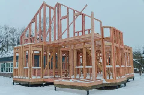 Construction of a timber frame house on screw piles Fotos Stock