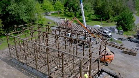 Construction of Timber Frame Wooded Structure in a Green Outdoor Setting Du.. Stock Footage 320841926
