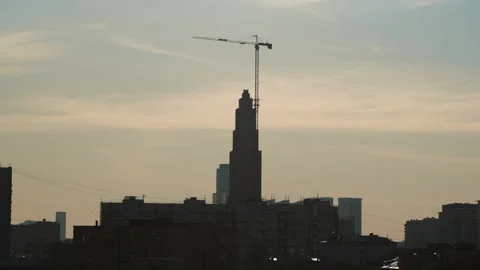 Construction time lapse of crane building a house. Cloudy sky background moscow Stock Footage 171400393