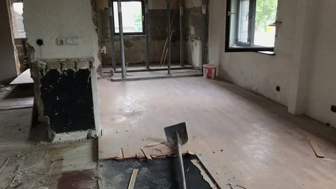 Construction time lapse - two young worker men removing laminate from the floor Stock Footage 91150903