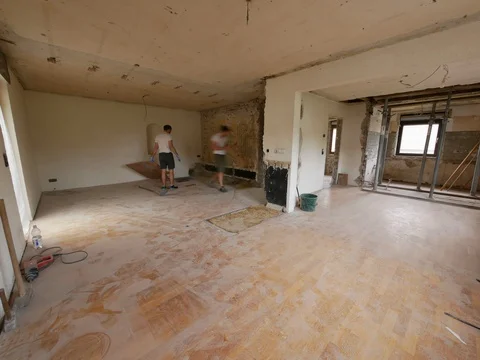 Construction time lapse - two young worker men removing laminate from the floor Stock Footage 91153704