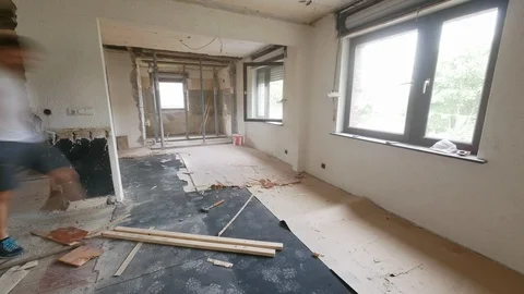 Construction time lapse - two young worker men removing laminate from the floor Stock Footage 91153938