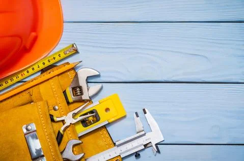 Construction tool kit for builder in bag on blue wooden boards Stock Photos