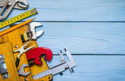 Construction tool kit for builder in bag on blue wooden boards Stock Photos