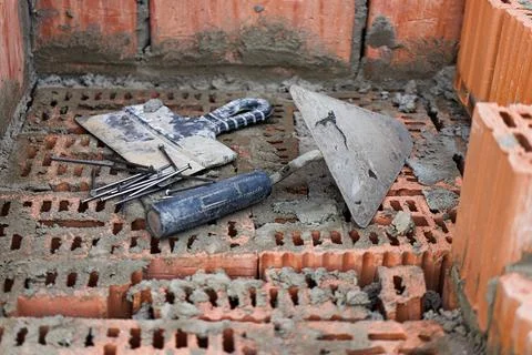 Construction tool for laying bricks and blocks. Bricklayer's tools - hammer,  Photos