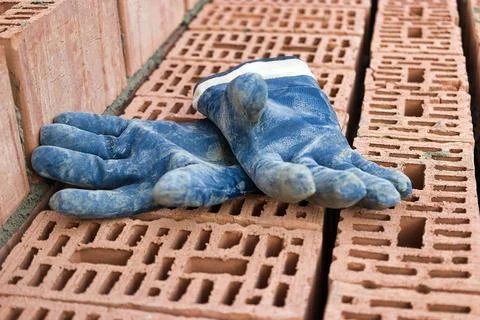 Construction tool for laying bricks and blocks. Bricklayer's tools - hammer,  Photos