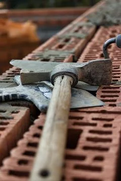 Construction tool for laying bricks and blocks. Bricklayer's tools - hammer.. Stock Photos
