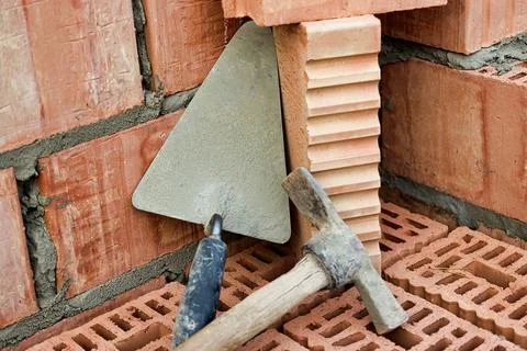 Construction tool for laying bricks and blocks. Bricklayer's tools - hammer,  스톡 사진