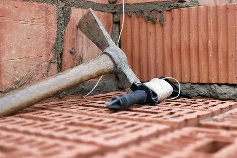 Construction tool for laying bricks and blocks. Bricklayer's tools - hammer,  Photos
