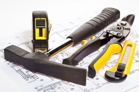 Construction tools and blueprint Stock Photos