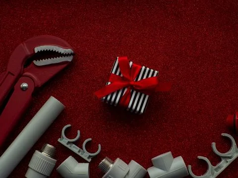 Construction tools and gift on red background Stock Photos