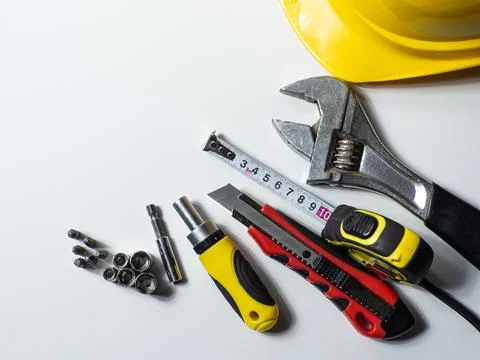Construction tools, hard hat on white background with copy space Stock Photos