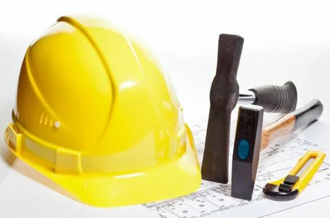 Construction tools, hardhat and blueprint Stock Photos