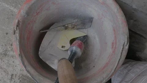 Construction Tools Inside a Cement Bucket on Building Site Stock Footage 341841104