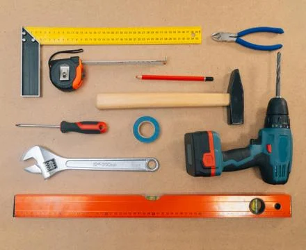Construction tools on a light background. The concept of using tools to make  Stock Photos