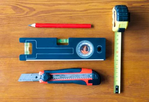 Construction tools lying on the table Stock Photos