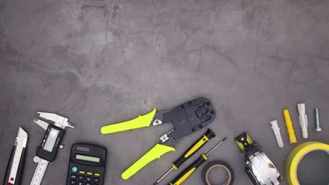 Construction tools moving on bottom of dark theme. Stop motion Stock Footage 136917476