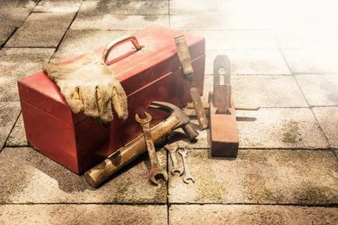 Construction tools with red tools box on brick ground. Foto stock