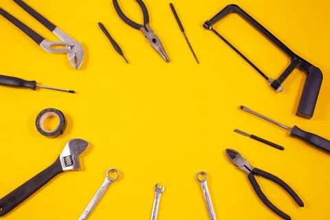 Construction tools for repairs Various carpentry on yellow background. T Stock Photos