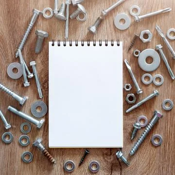 Construction tools. The screws, nuts and bolts arranged around blank spiral b Stock Photos