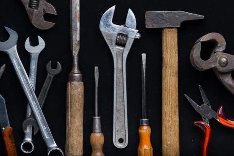 Construction tools set on dark background. Assortment instruments for repairman Stock Photos