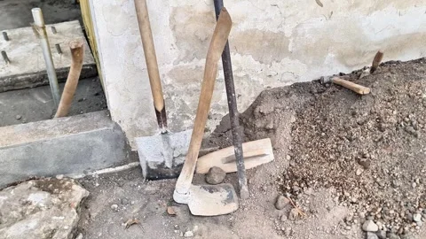 Construction Tools Set on Ground Shovel Hoe and Hand Tools at Building Site 스톡 동영상 332057044