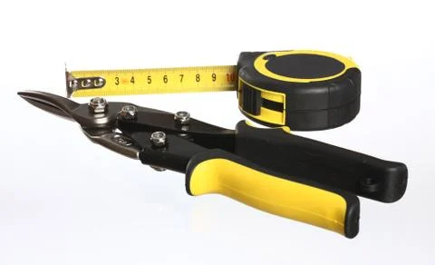 Construction tools: snips and tape measure Stock Photos